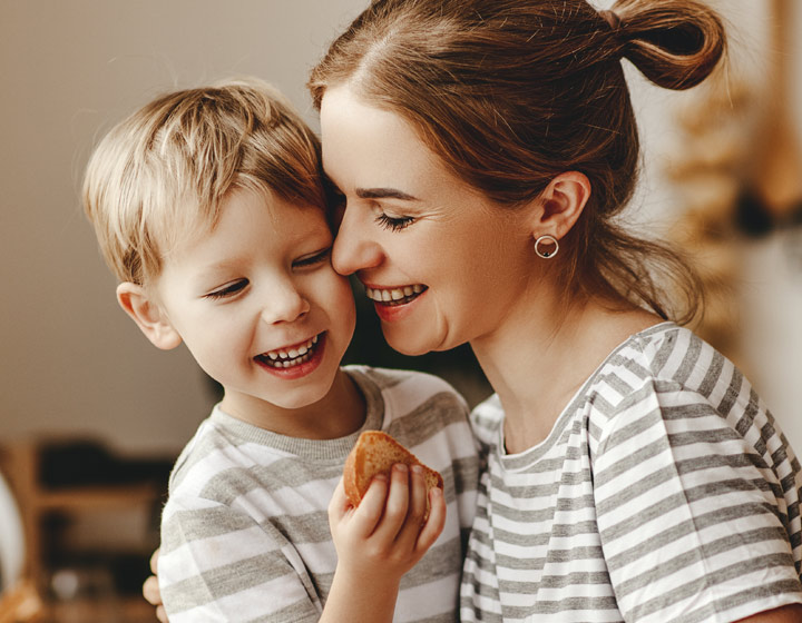 Woman with child holding bread