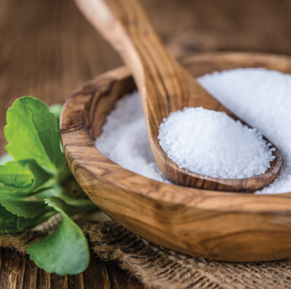 Raw stevia in wooden bowl